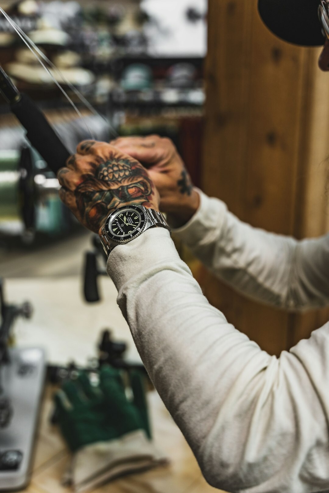 Watchmaker's hands adjusting a mechanical timepiece with tools