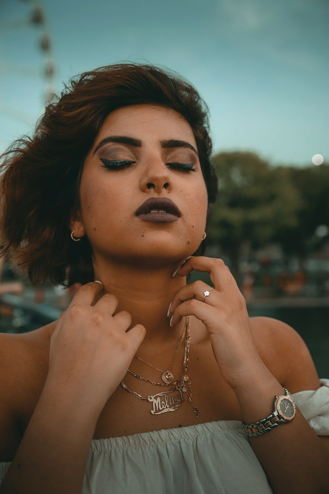 woman trying on luxury necklace