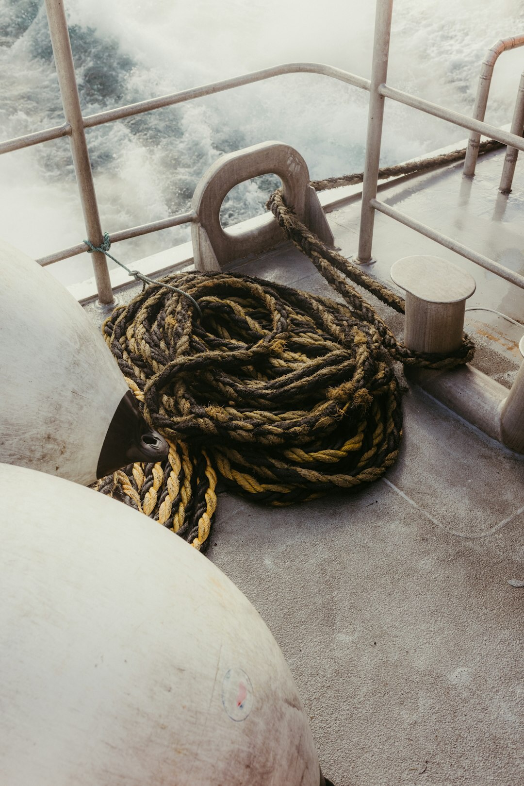 Steel diving chronograph watch on a boat deck rope