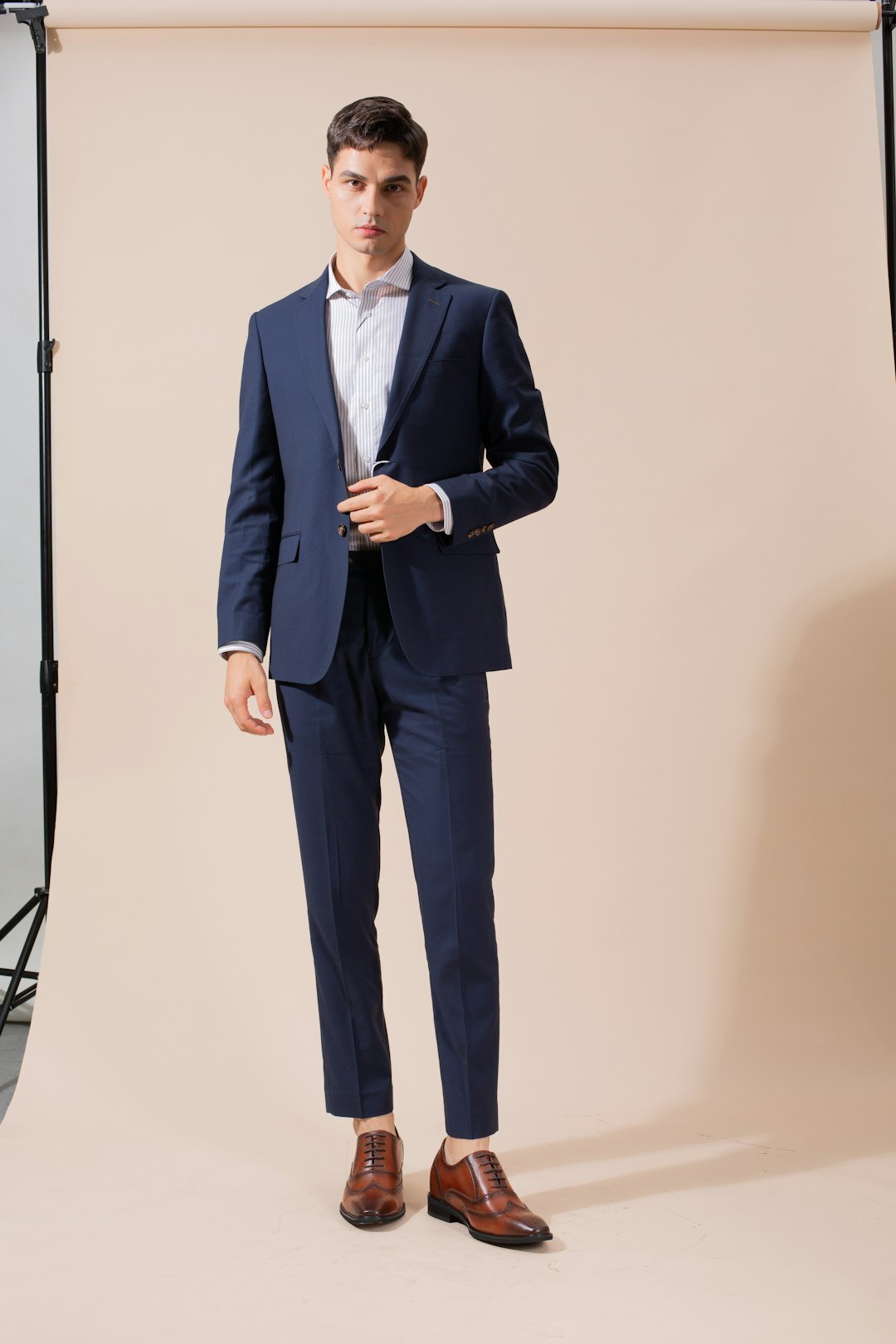 Studio portrait of a distinguished Uruguayan boutique director in tailored attire